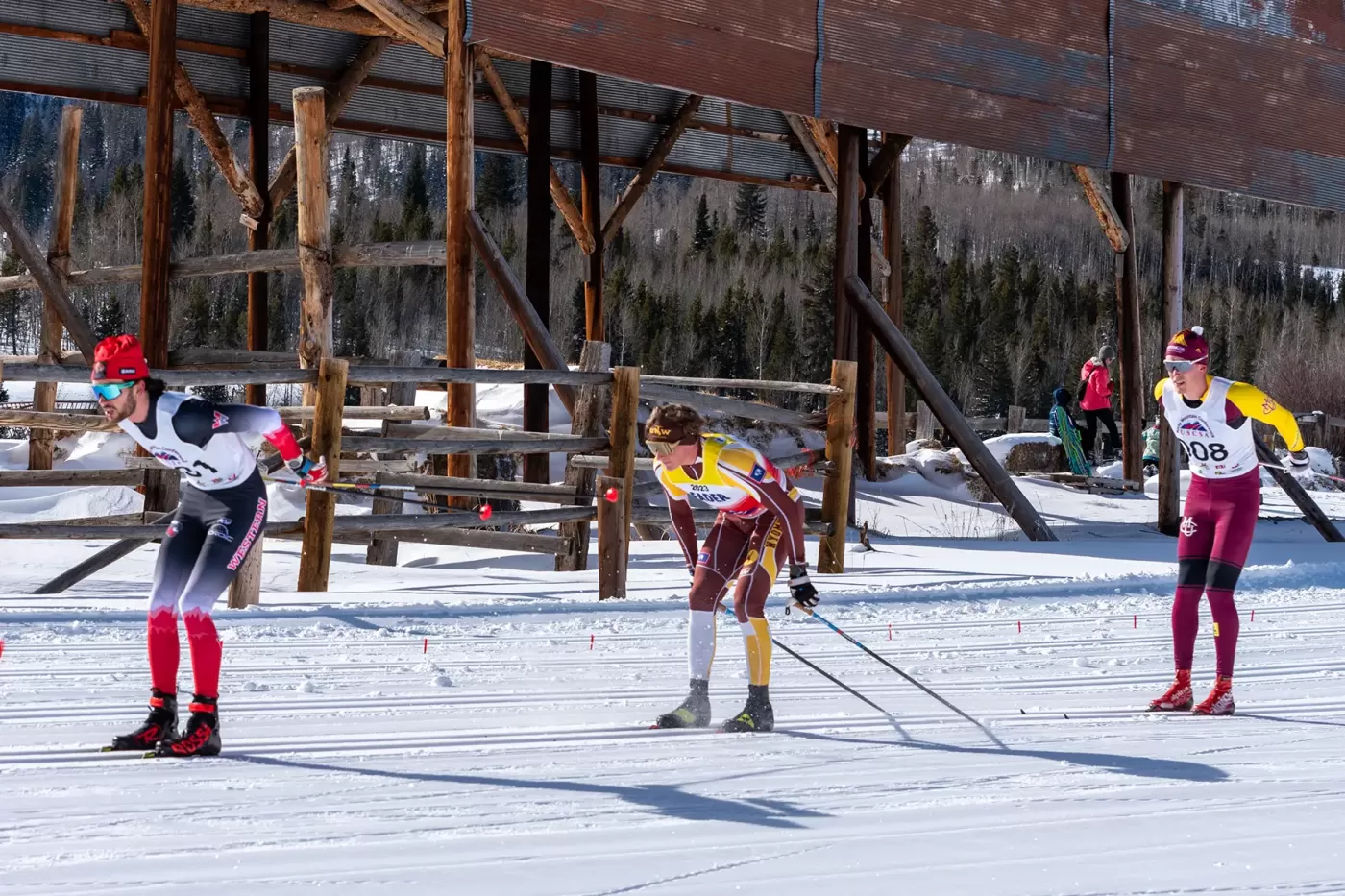 Photo of college ski racers during USCSA race at Snow Mountain Ranch in January 2024.
