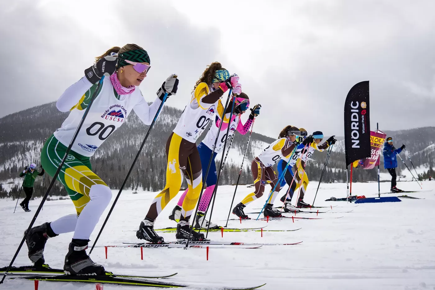 Photo of college ski racers during USCSA race at Snow Mountain Ranch in January 2024.