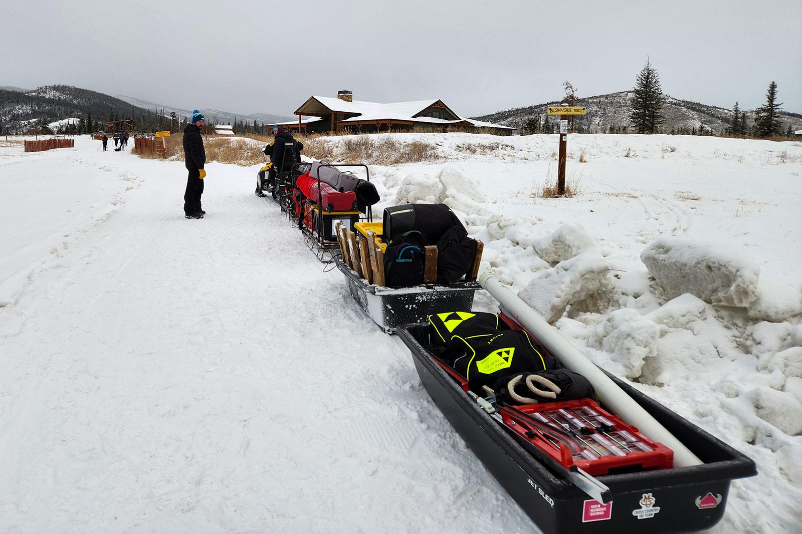 Early morning race setup at Snow Mountain Ranch. Jeff Paulson, Nordic Director, with Sean on the snowmobile, getting everything dialed before athletes arrived.