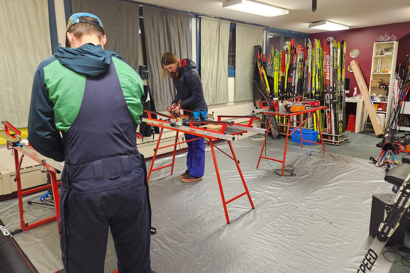 Ski team working on their skis